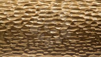 Metal background, gold color, corrugated texture 