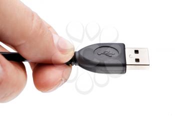 Fingers holding usb cable, isolated on white