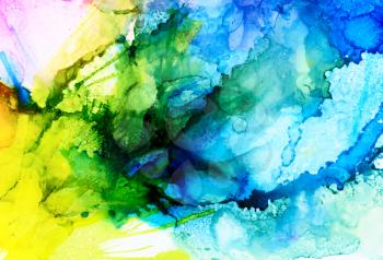 Abstract raster blue merging with yellow.Colorful background hand drawn with bright inks and watercolor paints. Color splashes and splatters create uneven artistic modern design.