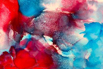 Abstract textured painted red blue flow.Colorful background hand drawn with bright inks and watercolor paints. Color splashes and splatters create uneven artistic modern design.