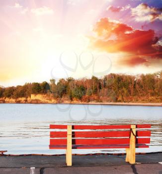 Royalty Free Photo of a Bench on a Lake