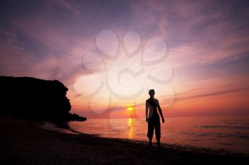 Royalty Free Photo of a Silhouette of a Boy on a Beach