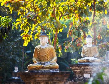 Royalty Free Photo of Buddha Statues in a Garden in Myanmar