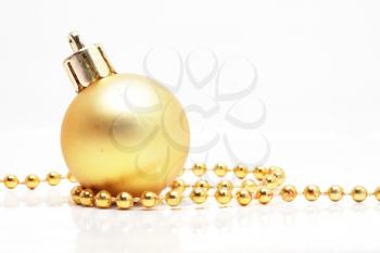 Royalty Free Photo of a Christmas Ball and String of Beads