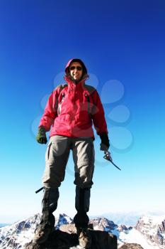Royalty Free Photo of a Mountain Climber on a Peak