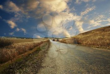 Royalty Free Photo of a Road and Car in the Crimean Countryside
