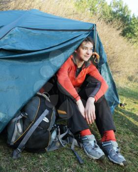 Royalty Free Photo of a Girl Sitting in a Tent