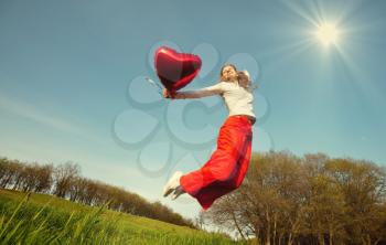 Royalty Free Photo of a Woman Holding a Balloon