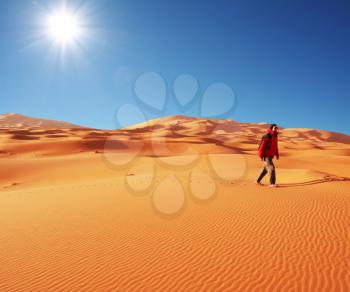 Royalty Free Photo of a Man Walking in a Desert