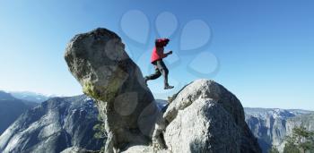 Royalty Free Photo of a Person Walking on Boulders in Yosemite
