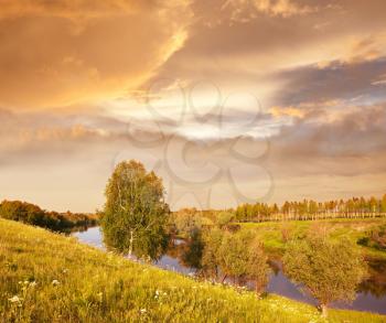 Royalty Free Photo of a Meadow and River