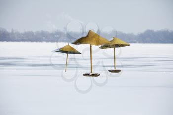 Royalty Free Photo of Parasols on a Winter Beach
