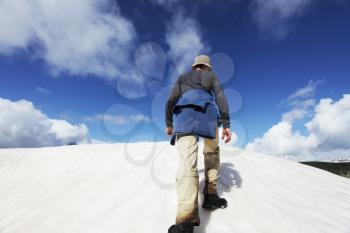 Royalty Free Photo of a Man Climbing a Mountain