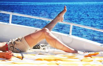 Royalty Free Photo of a Girl Relaxing on a Boat