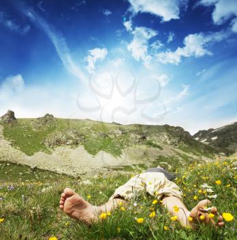 Royalty Free Photo of a Man Relaxing inthe Mountains