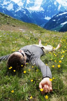 Royalty Free Photo of a Man Relaxing inthe Mountains 