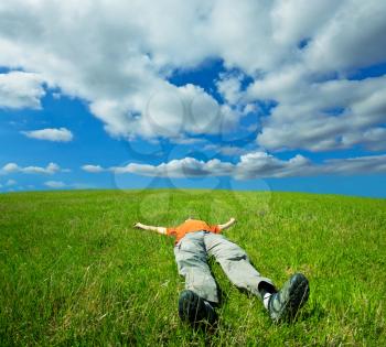 Royalty Free Photo of a Man Relaxing in a Field