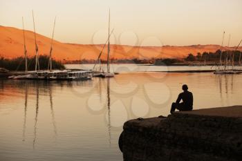 Royalty Free Photo of a Man Relaxing on the Nile