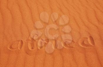Royalty Free Photo of a the Word Africa Written in Sand