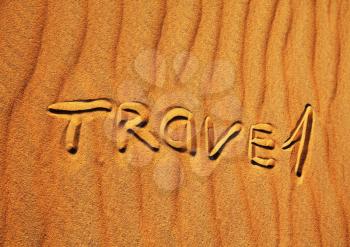 Royalty Free Photo of the Word Travel Written in the Sand
