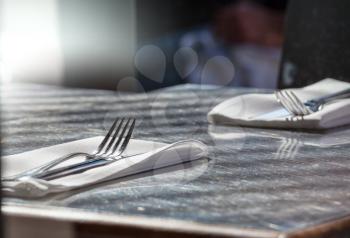 fork and knife on table in restaurant