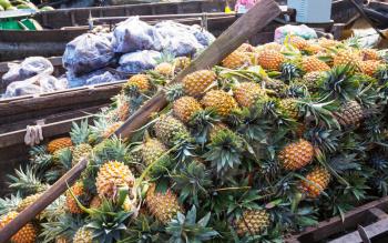 Pineapples for sale at the floating food market, Mekong delta, Vietnam