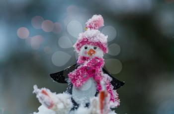 Snowman in winter background