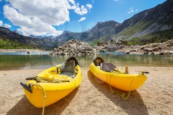 kayaking in mountains lake  in the summer season