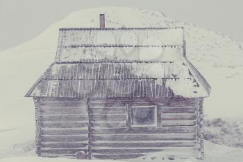 Wooden hut in the mountains in winter.Instagram filter.