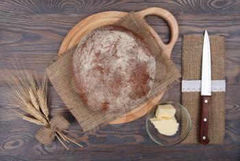 Rustic food background with rye homemade bread