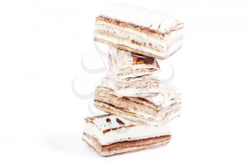 Few pieces of nougat stacked together on white