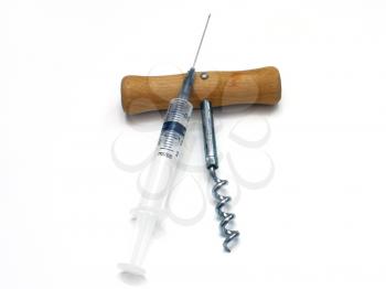 The syringe and corkscrew on a white background lie the friend on the friend separately