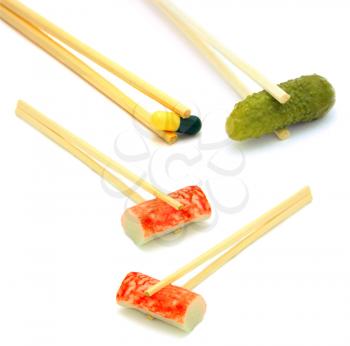 sushi cucumber and  tablet on chopstick