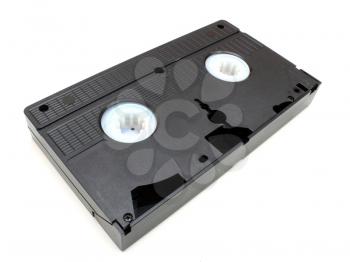 The black old videocassette costs on a white background an underside upwards