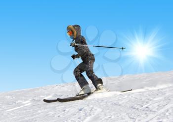 The young girl on skis goes from mountain in a spotty suit