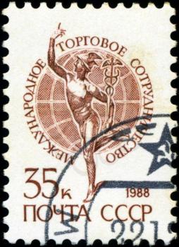 USSR - CIRCA 1988: A stamp printed in USSR shows The international trade cooperation, series Emblem , circa 1988