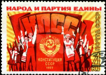 USSR - CIRCA 1977: A stamp printed in the USSR, shows a group of people at a rally meeting, the inscription people and the party united, Party, constitution of the USSR in 1977 , circa 1977