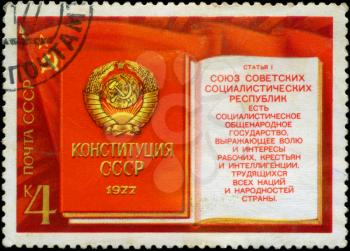 RUSSIA - CIRCA 1977: stamp printed by Russia, shows Flag of USSR, Constitution (Book) with Coat of Arms, circa 1977