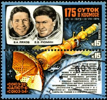 USSR - CIRCA 1979: A stamp printed in the USSR shows Soviet cosmonauts Lyakhov and Ryumin and Salyut 6, with the same inscription, from the series 175 Days in Space, circa 1979