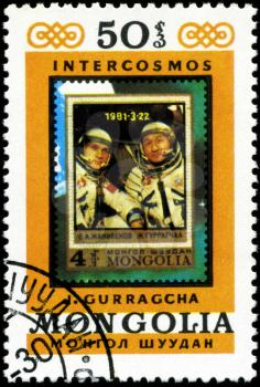 MONGOLIA - CIRCA 1981: A stamp printed in Mongolia showing stamp with cosmonaut B.  Dzhanibekov and J.Gurragchaa, circa 1981