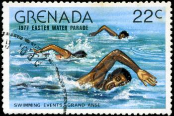 GRENADA - CIRCA 1977: A stamp printed in Grenada issued for the easter water parade  shows swimming events grand anse, circa 1977.