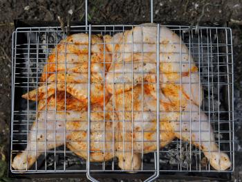 Roast chicken on grill