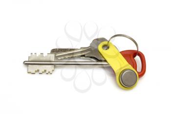 Keys to the apartment on white background . The concept of the popularity new housing.