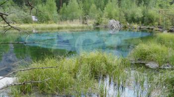 Amazing blue geyser lake in the mountains of Altai, Russia.