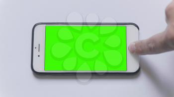 MOSCOW - JUNE 3, 2017: firmware updatethe Apple iPhone on a white background green screen in Russia on June 3, 2017 in Moscow, Russia.