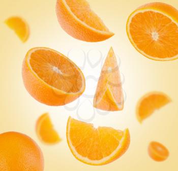 flying sliced orange fruit segments    background