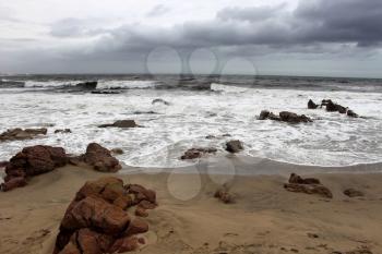 Picture of Beachfront in Stormy Weather with Sharp Rocks