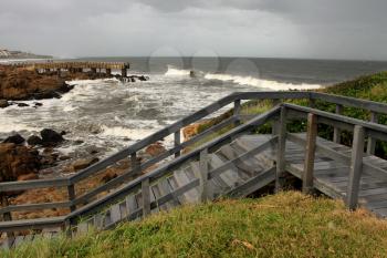 Picture of Wooden Steps and Concrete Jetty in Storm over Sea