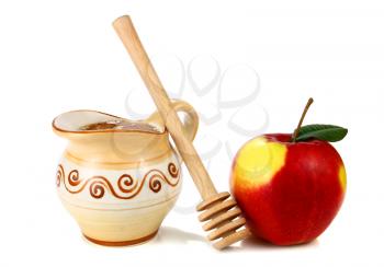 honey in a jug and apple isolated on white background