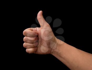 Thumb up hand isolated on black background 